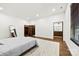 Bright bedroom featuring hardwood floors, a queen bed, and modern decor at 13124 Lemmond Dr, Matthews, NC 28105