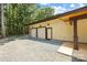 Three-car garage with a gravel parking area at 13124 Lemmond Dr, Matthews, NC 28105