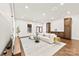 Open living room with hardwood floors and natural light at 13124 Lemmond Dr, Matthews, NC 28105