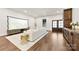 Bright living room with hardwood floors and double doors to the exterior at 13124 Lemmond Dr, Matthews, NC 28105