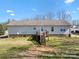 Spacious backyard view features a deck with stairs and mature trees at 1345 Beagle Run, Salisbury, NC 28146