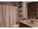 Bathroom featuring decorative shelving, vanity, and shower with neutral tones at 1345 Beagle Run, Salisbury, NC 28146