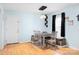 Dining room with natural light, wooden table with seating for four, and hardwood floors at 1345 Beagle Run, Salisbury, NC 28146