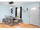 Dining room with natural light, wooden table with seating for four, and hardwood floors at 1345 Beagle Run, Salisbury, NC 28146