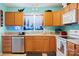 Kitchen featuring stainless steel appliances, warm oak cabinets, and neutral countertops at 1345 Beagle Run, Salisbury, NC 28146