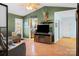 Cozy living room featuring an entertainment center and views into the kitchen at 1345 Beagle Run, Salisbury, NC 28146