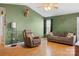 Spacious living room featuring two couches, hardwood floors, and a ceiling fan at 1345 Beagle Run, Salisbury, NC 28146