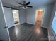 Spacious bedroom with a ceiling fan, walk-in closet, and an ensuite bathroom with modern finishes at 1404 Lineberger Ave, Gastonia, NC 28052