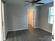 Comfortable bedroom with hardwood floors, ceiling fan, and ample natural light at 1404 Lineberger Ave, Gastonia, NC 28052