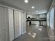 Well-lit kitchen with stainless steel appliances, granite counters, and a large pantry at 1404 Lineberger Ave, Gastonia, NC 28052