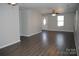 Spacious living room with hardwood floors, ceiling fan, and natural light at 1404 Lineberger Ave, Gastonia, NC 28052