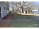 Large backyard features mature trees, a shed, and plenty of open space for outdoor activities at 1426 E Council St, Salisbury, NC 28146