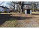 The spacious backyard offers a large tree, a tire swing, and a storage shed at 1426 E Council St, Salisbury, NC 28146