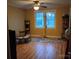 Comfortable bedroom with hardwood floors, a ceiling fan, and natural light from the window at 1426 E Council St, Salisbury, NC 28146