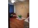 A cozy bedroom features hardwood floors, warm paint, and natural light filtering through the curtains at 1426 E Council St, Salisbury, NC 28146