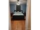 Bedroom with hardwood floors, a teddy bear on the bed, and dual nightstands at 1426 E Council St, Salisbury, NC 28146