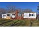 Traditional single-story home with a brick chimney, contrasting white siding, and a neatly kept lawn at 1426 E Council St, Salisbury, NC 28146