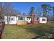 Charming single Gathering home with a brick chimney and well-maintained front lawn on a sunny day at 1426 E Council St, Salisbury, NC 28146