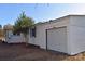 Detached white garage next to the house showing a closed garage door and side access at 1426 E Council St, Salisbury, NC 28146