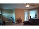 Cozy living room with hardwood floors, a ceiling fan, and an adjacent room at 1426 E Council St, Salisbury, NC 28146