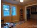 Bright living room with hardwood floors, a ceiling fan, and large windows for natural light at 1426 E Council St, Salisbury, NC 28146