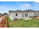 Spacious backyard featuring a concrete patio and well-maintained lawn, offering a private outdoor space at 1529 Pebble Shore Ln # 164, Belmont, NC 28012