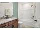 This bathroom boasts a granite vanity, a white toilet and shower-tub combo, and sleek, dark hardware at 1529 Pebble Shore Ln # 164, Belmont, NC 28012