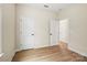 Bedroom featuring hardwood floors and multiple closet doors at 1529 Pebble Shore Ln # 164, Belmont, NC 28012