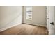 Bedroom featuring hardwood floors, window with blinds, and neutral paint at 1529 Pebble Shore Ln # 164, Belmont, NC 28012