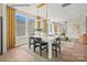 Dining room with a large window, modern lighting, and wood flooring at 1529 Pebble Shore Ln # 164, Belmont, NC 28012