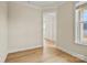 Bright hallway featuring light colored walls, clean white trim, and beautiful vinyl flooring throughout at 1529 Pebble Shore Ln # 164, Belmont, NC 28012