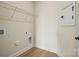 Laundry area or closet with hardwood floors, wire shelving, and utility connections at 1529 Pebble Shore Ln # 164, Belmont, NC 28012