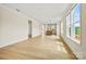 Spacious open-concept living room boasts lots of natural light and durable vinyl flooring throughout the space at 1529 Pebble Shore Ln # 164, Belmont, NC 28012