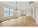 Bright living room with large windows and modern lighting, perfect for entertaining and relaxation at 1529 Pebble Shore Ln # 164, Belmont, NC 28012