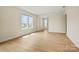 Sunlit living room with sleek vinyl flooring and large windows offering great neighborhood views at 1529 Pebble Shore Ln # 164, Belmont, NC 28012