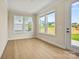 Bright sun room with ample natural light and pleasant outdoor views, ideal for relaxation or home office at 1529 Pebble Shore Ln # 164, Belmont, NC 28012