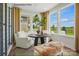 Bright and airy sunroom with large windows offering scenic views at 1529 Pebble Shore Ln # 164, Belmont, NC 28012
