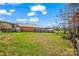 Sizeable backyard with a wooden deck, a wooden fence, and mature trees that provide backyard seclusion at 2232 Triplett Rd, Mt Ulla, NC 28125