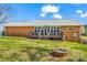 Backyard of home with a deck, sunroom, and fire pit at 2232 Triplett Rd, Mt Ulla, NC 28125