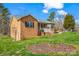 Brick exterior with manicured landscaping, a welcoming front porch, and a well-maintained lawn and shrubbery at 2232 Triplett Rd, Mt Ulla, NC 28125