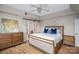 Main bedroom features a sliding barn door to the bathroom, ceiling fan and wood floors at 2232 Triplett Rd, Mt Ulla, NC 28125