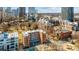 Aerial view of the building in a vibrant urban setting with nearby park at 224 N Poplar St # 9, Charlotte, NC 28202