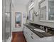 Bathroom features dual sinks, granite countertop, and glass enclosed shower at 224 N Poplar St # 9, Charlotte, NC 28202