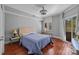 Comfortable bedroom with hardwood flooring, neutral walls, and natural light at 224 N Poplar St # 9, Charlotte, NC 28202