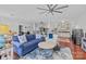 Spacious living room flows into the dining room and kitchen with wooden floors and lots of natural light at 224 N Poplar St # 9, Charlotte, NC 28202
