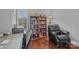Office space features desk, bookcase, chair, and natural light at 224 N Poplar St # 9, Charlotte, NC 28202