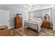 Comfortable bedroom with ceiling fan, wood-look floors, and classic furniture at 2621 Marble St, Newton, NC 28658