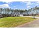 Charming single-Gathering home with a well-manicured lawn, an attached two-car garage, and classic curb appeal at 2621 Marble St, Newton, NC 28658