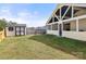 View of the backyard with a large shed and partially fenced in yard at 3009 Rockingham Sw Ct, Concord, NC 28025