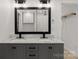 Bathroom featuring double sinks, large mirror, and modern fixtures at 3009 Rockingham Sw Ct, Concord, NC 28025